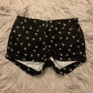 Black shorts with white flowers